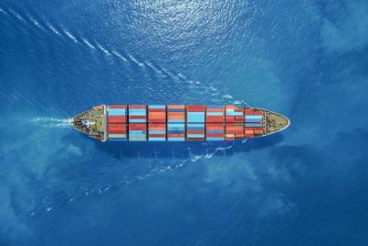 aerial view of a ship full of shipping containers